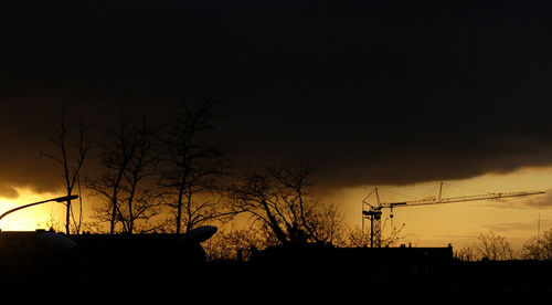 Silhouette of trees against sky during sunset