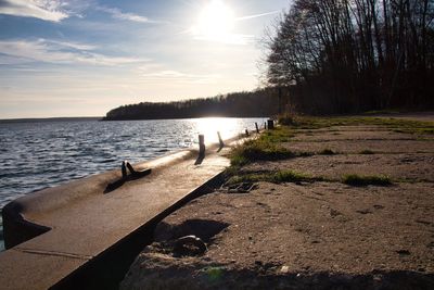 Scenic view of river against sky during sunset