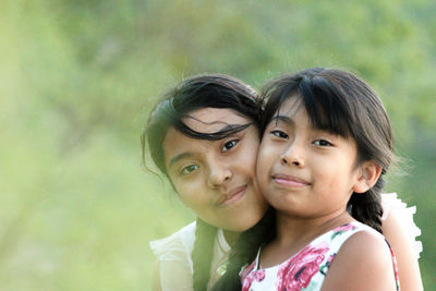 Two pretty girls smiling together