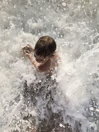 High angle view of person swimming in sea