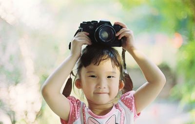 Portrait of boy photographing