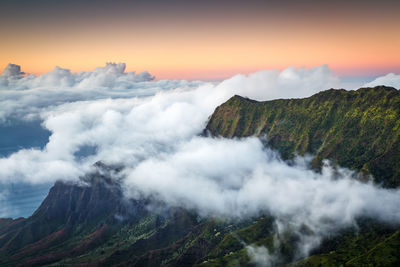 Scenic view of clouds over mountain against sky