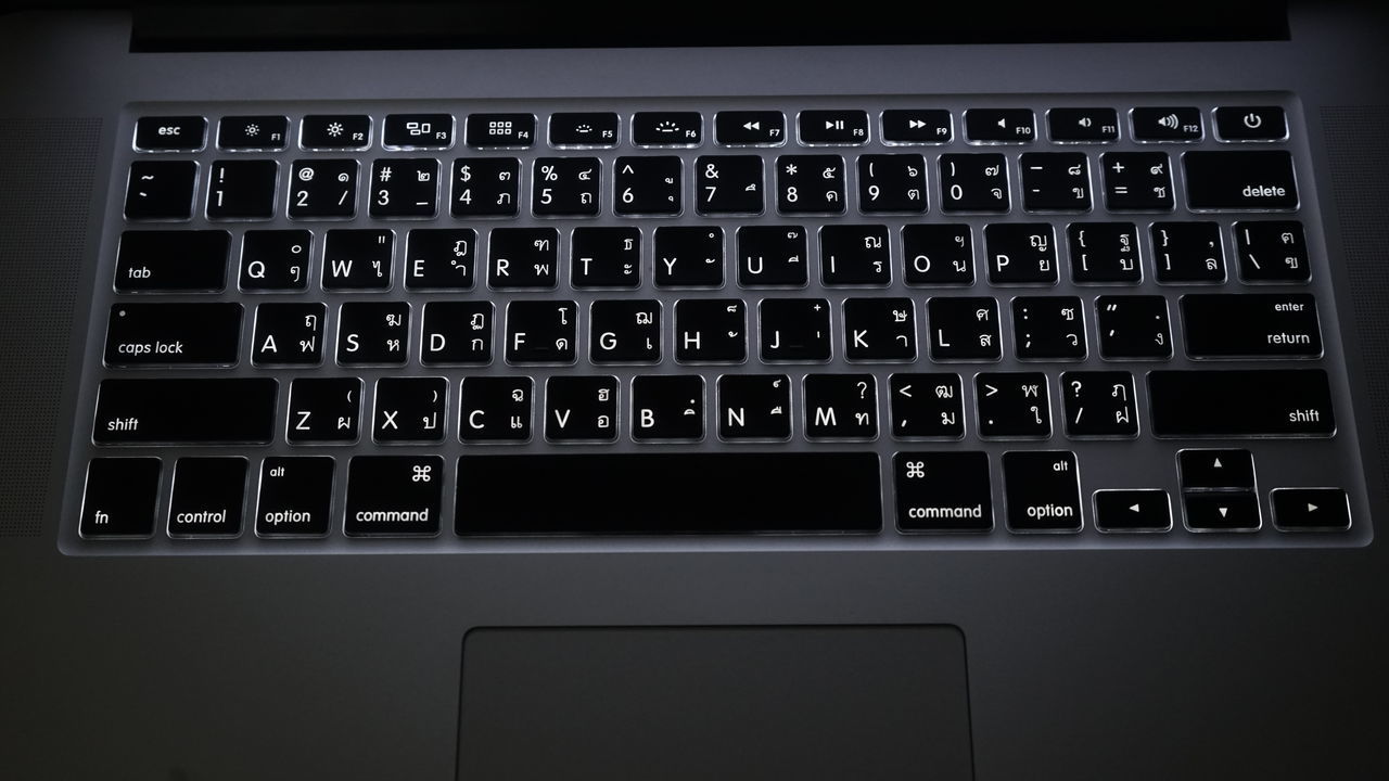 LOW ANGLE VIEW OF LAPTOP ON KEYBOARD