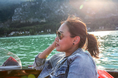 Close-up of young woman in boat 