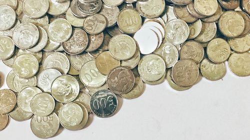 High angle view of coins on table