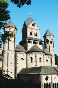 Low angle view of church against blue sky