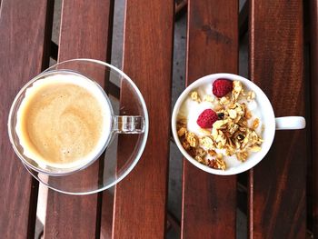 Top view of breakfast on table, coffee and yogurt