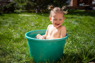 Portrait of cute boy swimming in water