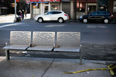 Empty metallic bench on street