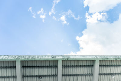 Low angle view of building against cloudy sky