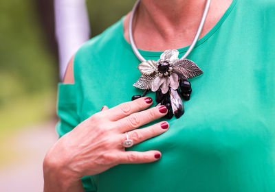 Close-up of woman holding butterfly