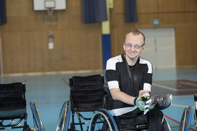 Sportsman in wheelchair in gym