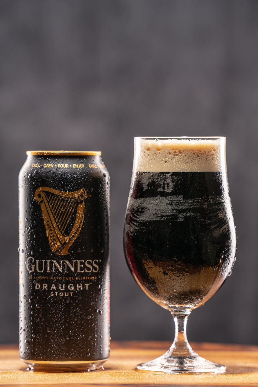 CLOSE-UP OF BEER GLASSES ON TABLE