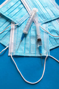 High angle view of cables on table against blue background