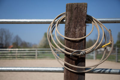 Close-up of metal railing against sky