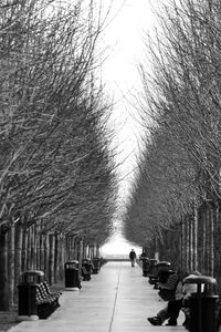 Rear view of woman walking on street