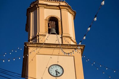 Low angle view of church against clear blue sky