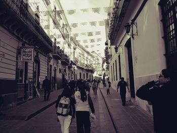 People walking on street in city