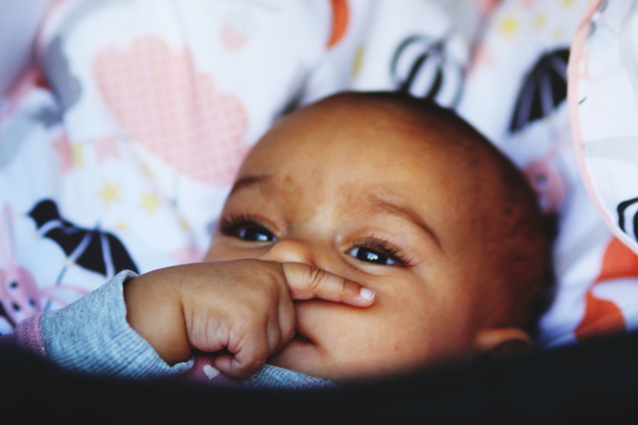 child, real people, one person, portrait, childhood, cute, indoors, innocence, babyhood, close-up, baby, young, headshot, human body part, toddler, looking at camera, front view, lifestyles, furniture, body part, human face