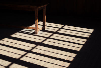 High angle view of sunlight falling on hardwood floor