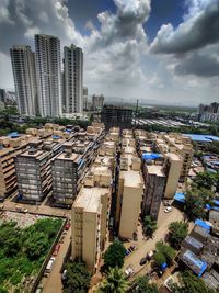 High angle view of buildings in city against sky