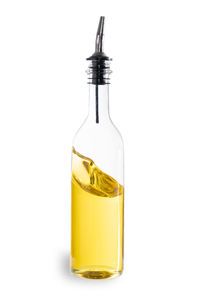 Close-up of yellow bottle against white background