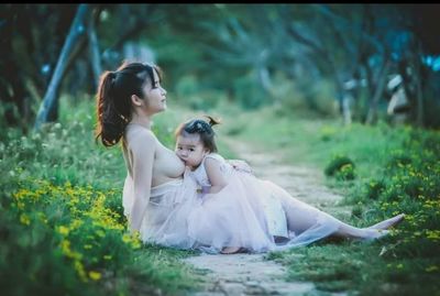 Women sitting on grass