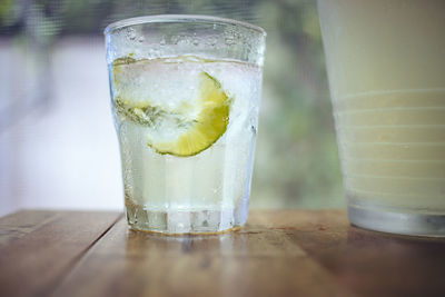 Close-up of lemon soda in glass on table