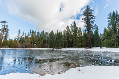 Scenic view of frozen lake against sky during winter