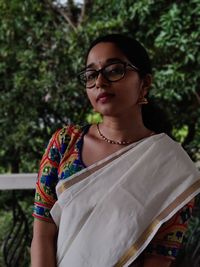 Portrait of a young woman wearing eyeglasses