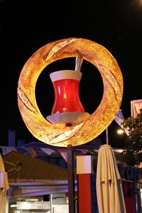 Low angle view of illuminated lamp in restaurant