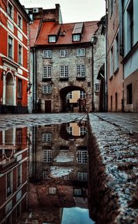 Canal amidst buildings in city