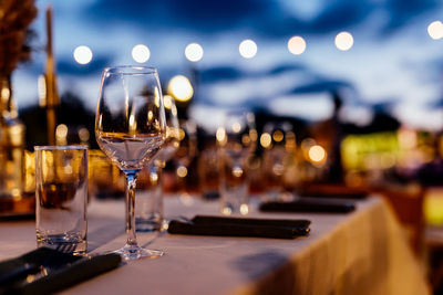 Luxury table settings for fine dining with and glassware, beautiful blurred background. 