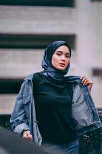 Portrait of young woman looking away