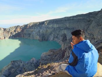 Hiker sitting on mountain