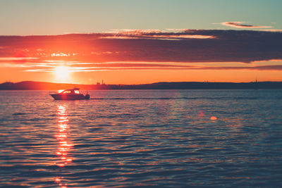 Sunset at lake näsijärvi in tampere with a boat