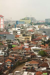 High angle view of buildings in city against clear sky