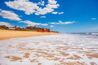 Scenic view of beach against sky