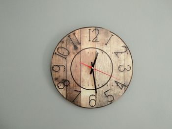 Close-up of clock against white background