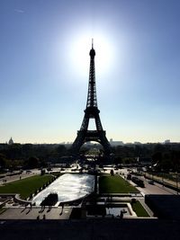 Low angle view of eiffel tower against sky in city on sunny day