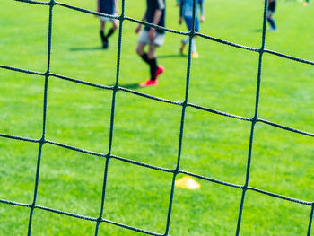 Soccer field seen through chainlink fence