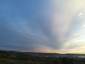 Scenic view of landscape against sky during sunset