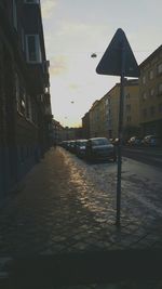 Buildings in city at sunset