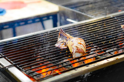 Close-up of meat on barbecue grill