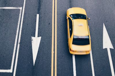 High angle view of arrow sign on road