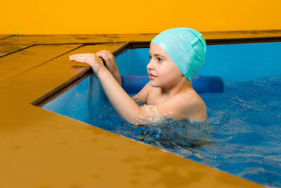 Portrait of woman looking at swimming pool