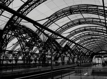 Low angle view of railroad station against sky