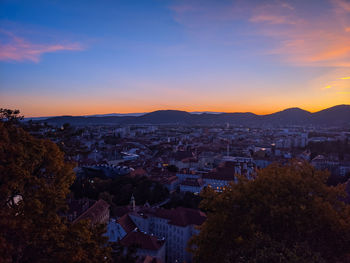 Cityscape against sky during sunset