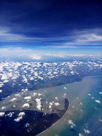 Aerial view of clouds over sea against sky