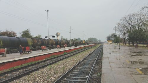 Train on railway tracks against sky